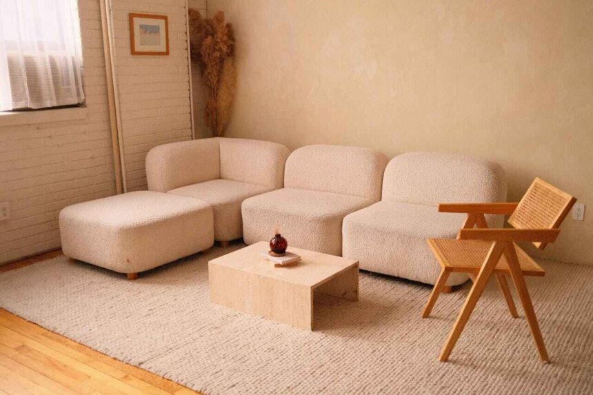 Boucle chairs and ottoman in a soft, beige living room