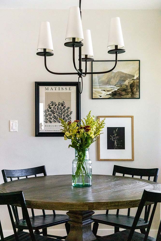 Modern hanging art arrangement with a bouquet