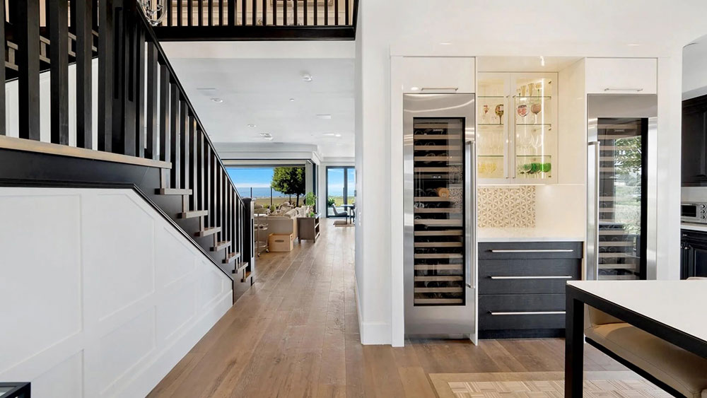 Modern hallway remodel with built-in wine storage and contemporary living room