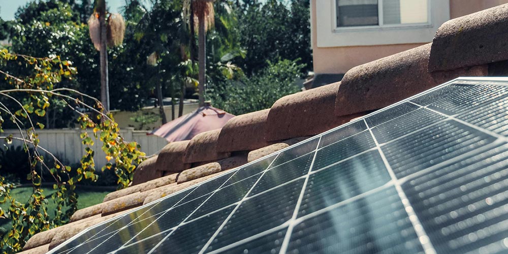 A close-up view of a solar panel mounted on the roof of a house