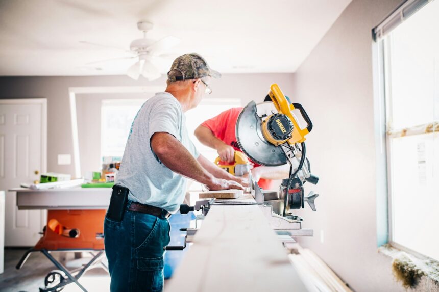 Two builders working inside home