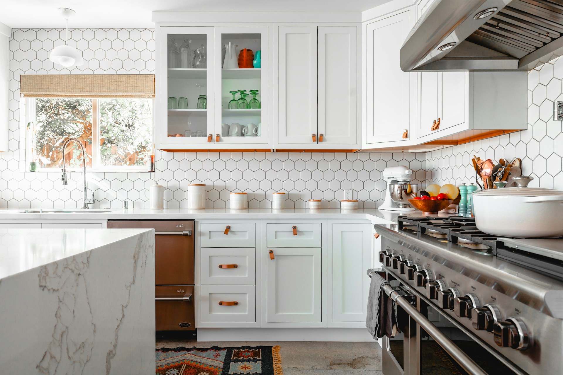 White feng shui kitchen with natural light and clear prep space